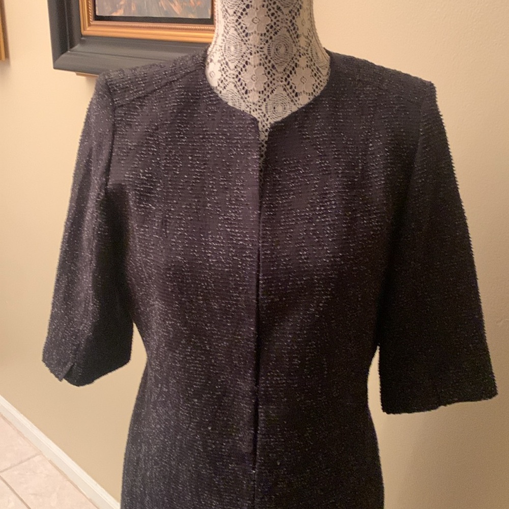 Elegance Tahari mid length design with three quarter sleeves